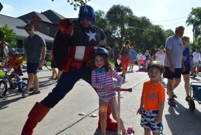 Captain America superhero costumed character at the west university 4th of July parade.