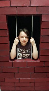 This super cool jail cell prop is available for your little heroes birthday party in Houston.
