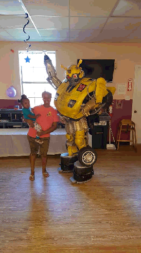Bumblebee transformer super hero costumed character for rental in houston, texas parties.