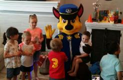 Chase from paw patrol mascot costumed character for a birthday party  in Pearland , Texas.
