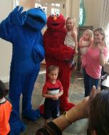 Cookie monster and elmo mascots in midtown houston, texas for a rental birthday party.