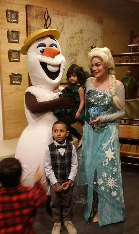 Costumed characters Elsa and Olaf from Frozen at a birthday party in Houston, Texas.