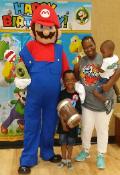 Mario mascot costumed character in Kingwood, Texas for a birthday party at lifetime fitness.