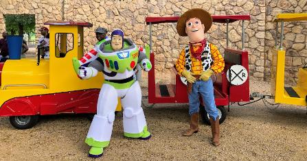 Party characters for kids in Houston with the mascot toy sheriff and toy astronaut by birthday party train in sugarland
