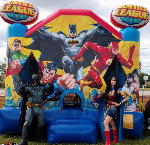 Party characters for kids in Houston with superheroes like bat hero and wonder hero by a Justice league moonwalk at Warwick construction Picnic in Clearlake