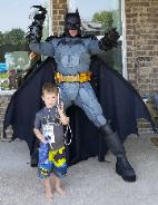 Rental available for a Batman superhero mascot costumed character for birthday parties with awesome photo props in Houston, Texas.